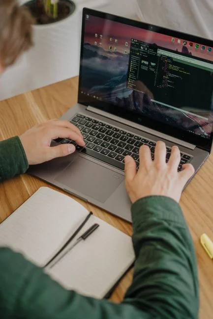A contemporary workspace showcasing a laptop, tablet, and smartphones, ideal for tech and freelance use.